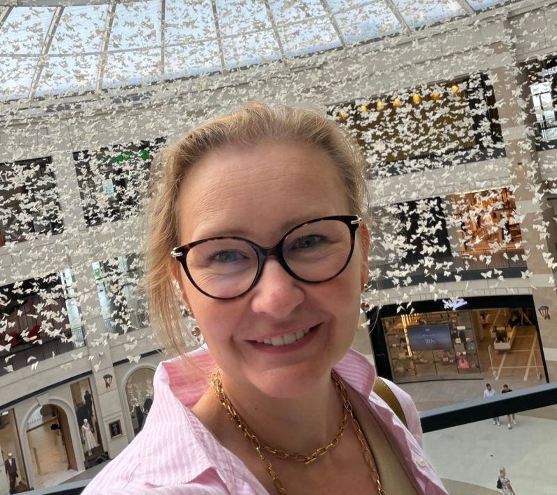 Olga Lavrenova beneath a ceiling of hanging butterflies